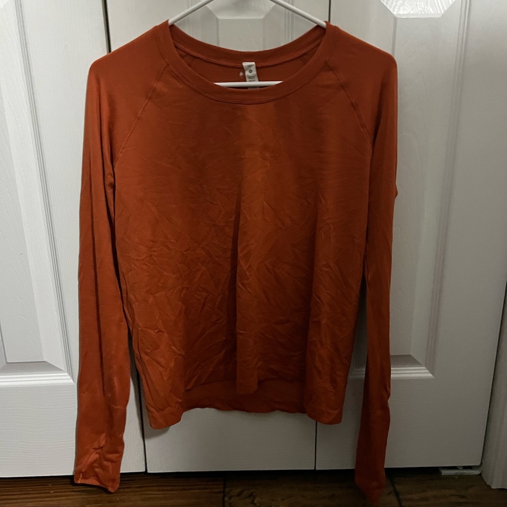 Size 12 orange lululemon swiftly tech long sleeve
